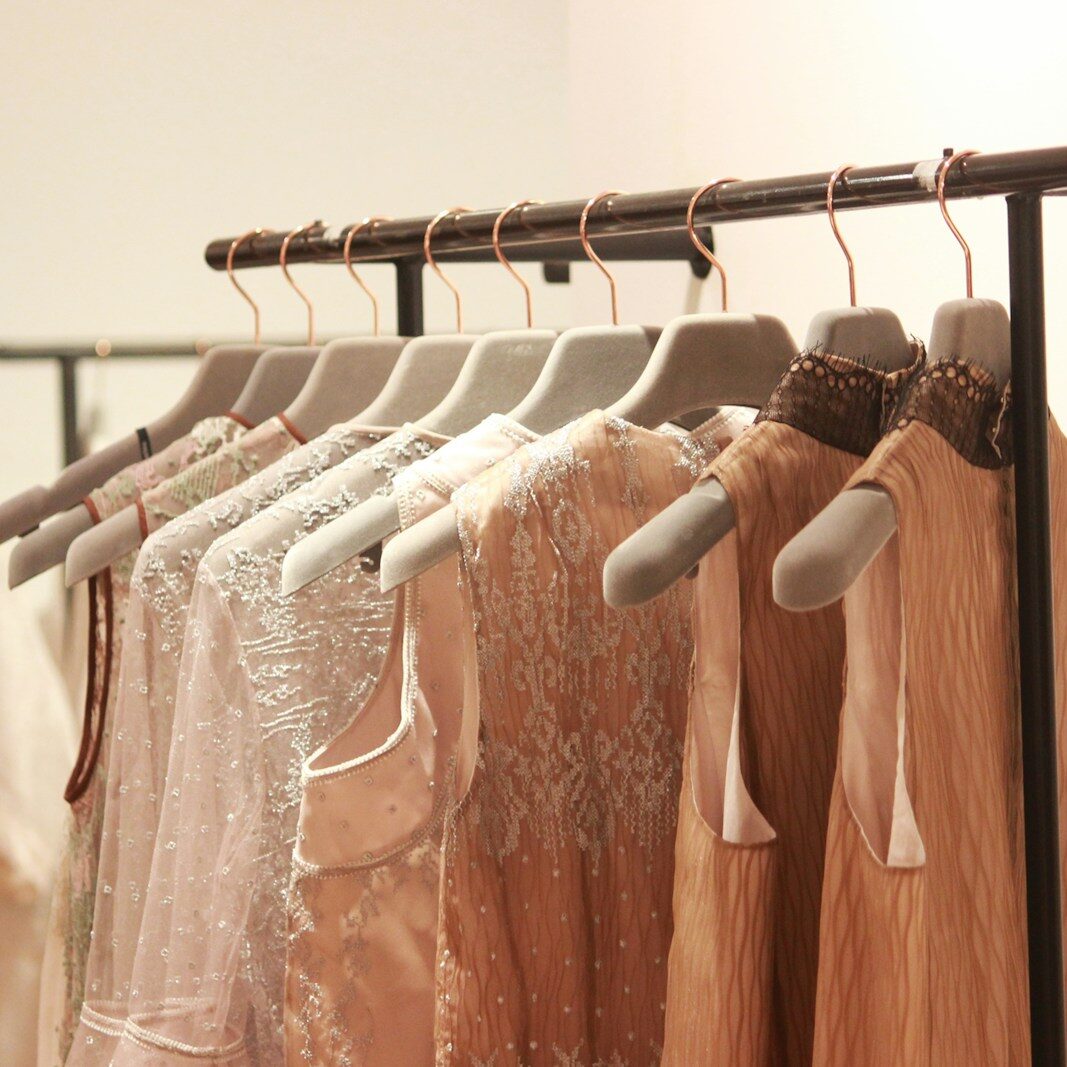 assorted tops hanging indoors